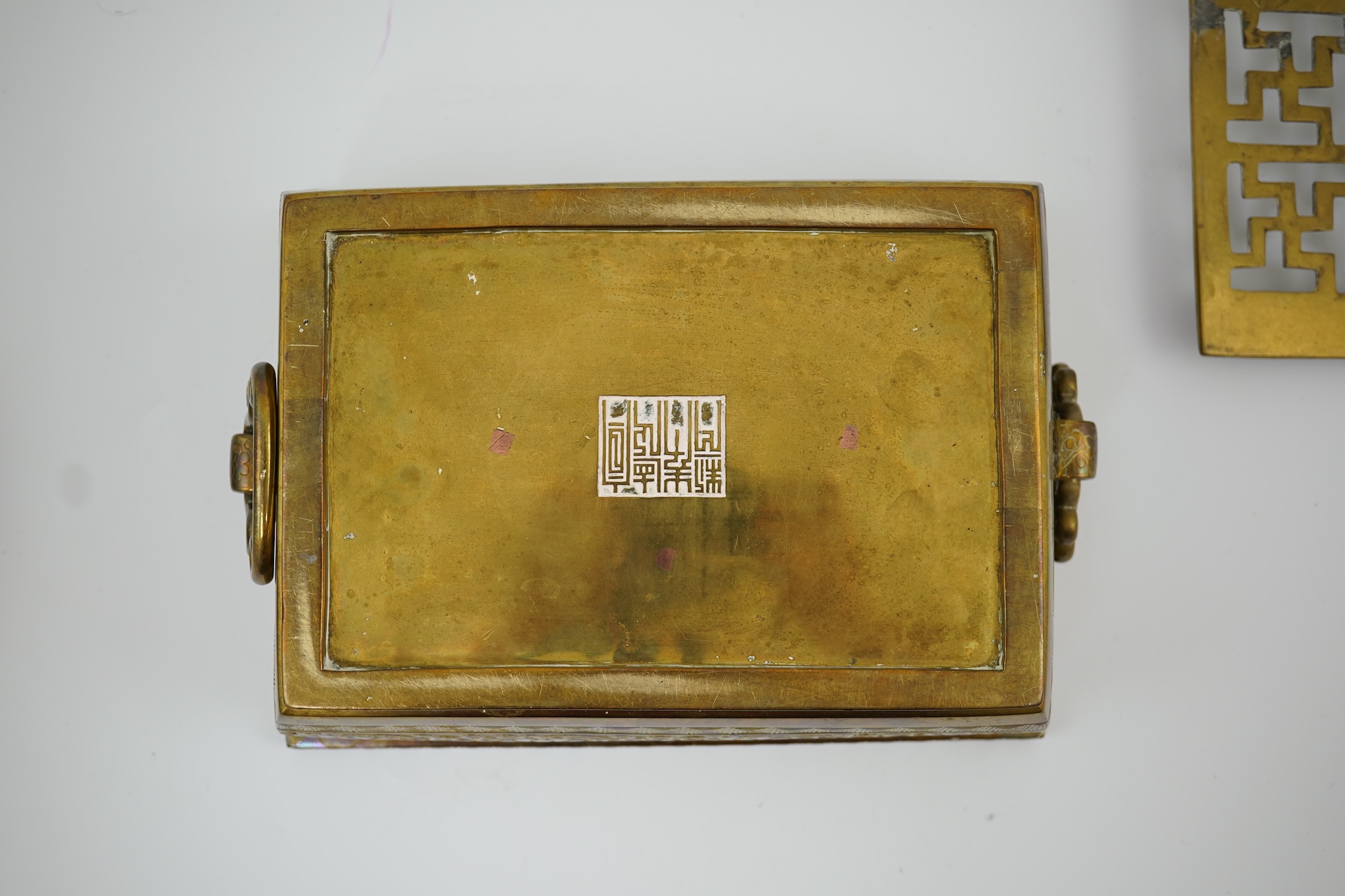 A large Chinese bronze rectangular censer and cover, Xuande seal mark, and a ‘plum blossom and chilong’ bronze censer, both 19th century